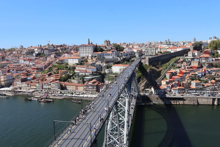 A stunning aerial view of the Dom Luís I Bridge and the historic city of Porto, Portugal.