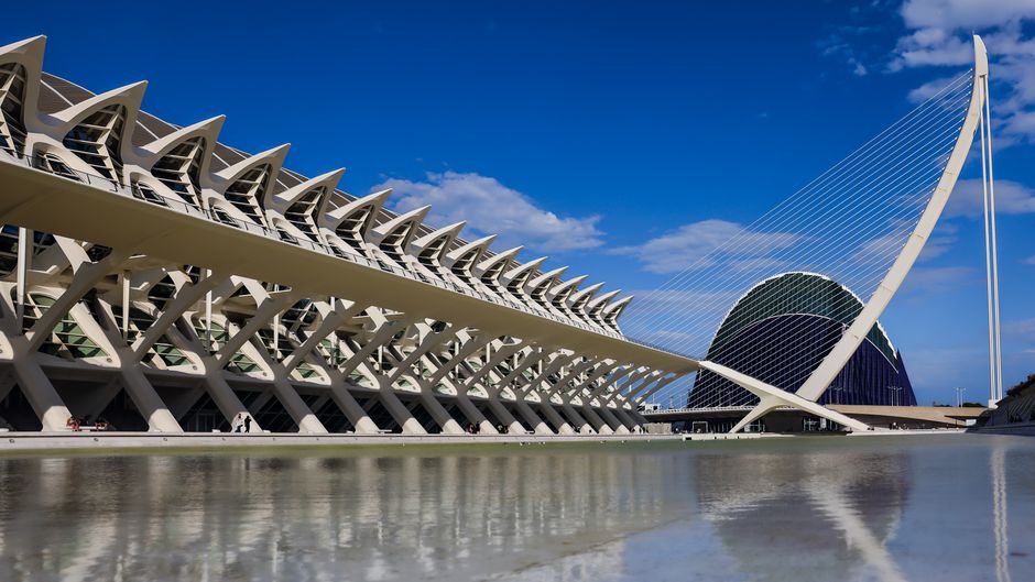 Striking architecture at Valencia's City of Arts and Sciences against a bright blue sky.