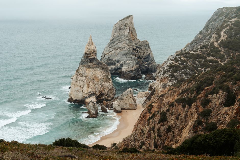 Scenic view of the iconic rock formations along Ursa Beach, Portugal's dramatic coastline.