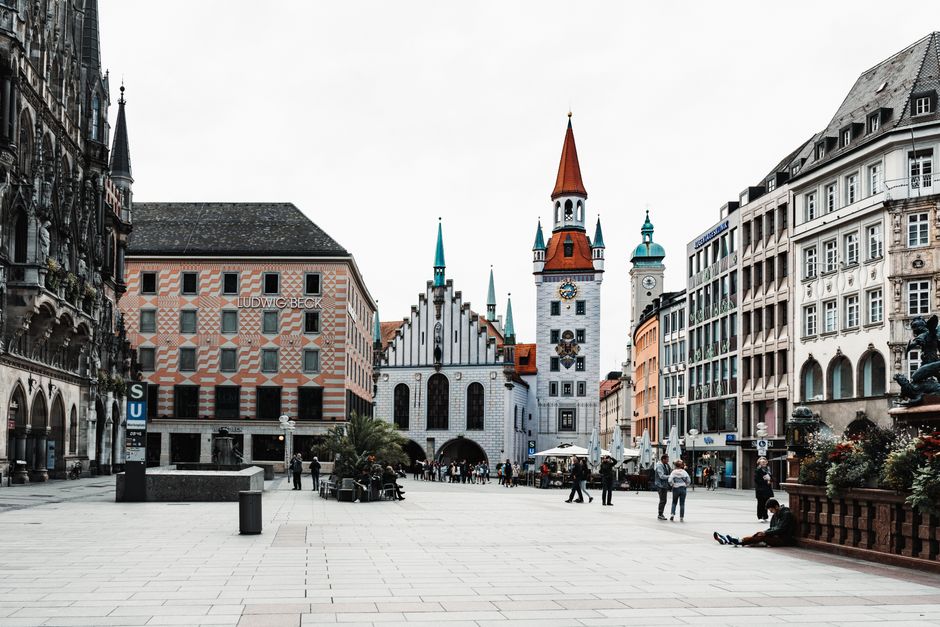 A bustling town square at Marienplatz, showcasing historic architecture in Munich, Germany.